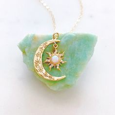 "DESCRIPTION: The AURORA Necklace - Gold crescent moon + opal sun pendant on a dainty gold filled chain. Wear it on its own for a celestial statement or layer it up with your favorite necklaces, either way your going to want to wear this beauty again and again. We love this celestial necklace and think you will too! MATERIALS: Chain, clasp, and jump rings - Gold filled Pendant - Gold plated, Opal, CZ stones PENDANT SIZE: Approximately 1\" in length PACKAGING: Your necklace will arrive on a Daint Aurora Necklace, Opal Moon Necklace, Silver Jewelry Cleaner, Sun And Moon Necklace, Necklace Moon, Necklace Opal, White Jewelry Box, Sun Pendant, Celestial Necklace