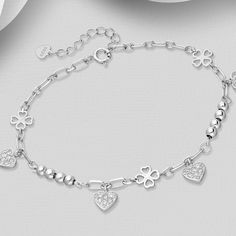 Elevate your elegance with our 925 Sterling Silver Clover Bracelet, featuring a heart design and sparkling CZ diamonds. Adjustable for perfect fit. Bracelet Length: 6½ - 7½" Silver Diamond Heart Bracelet As Gift, Classic Heart Bracelet In Cubic Zirconia As Gift, Classic Cubic Zirconia Heart Bracelet As Gift, Fine Jewelry White Gold Heart Bracelet With Cubic Zirconia, Fine Sterling Silver Bracelet With Sparkling Stones, Elegant Silver Diamond Heart Bracelet, Sterling Silver Heart Bracelet For Anniversary, Classic Cubic Zirconia Bracelets For Valentine's Day, Cubic Zirconia Bracelets For Anniversary On Valentine's Day