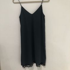 Navy Blue Slip Dress With Spaghetti Straps And Black Lace At The Bottom. Never Worn, Great Condition. Black Camisole Mini Dress For Beach, Black Camisole Mini Dress For The Beach, Black Cami Dress For Spring, Black Camisole Dress For Date Night, Black Camisole Dress For Beach, Casual Cami Dress With Lace Trim, Black Camisole Dress For The Beach, Black Camisole Dress For Spring, Casual Black Mini Dress Camisole Style