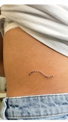 the back of a woman's thigh with an inscription on it that says, always and forever