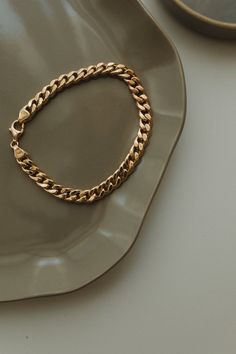 This 14K Gold Bracelet is a trendy bracelet that will bring a minimalist, modern, and fashion touch to your look. Its design is as elegant and simple and therefore is such a favorite piece and so easy to stack with other bracelets and bangles. Materials, - 14K Solid Gold Chain Bracelet - 8.5 Inches - 31 gr. - 8   Inches - 29 gr. - 7.5 Inches  -27 gr. - 7    Inches  - 25 gr. - 6.5 Inches  - 23 gr. Bangle has a bright finish. Available in yellow or white or rose gold. You can choose the thickness Modern Bracelets With Chunky Cuban Link Chain, Modern Chunky Chain Cuban Link Bracelets, Modern Chunky Cuban Link Chain Bracelet, Luxury Bracelets With Chunky Cuban Link Chain, Classic Cuban Link Bracelet With Chunky Chain For Everyday, Modern Chunky Chain Cuban Link Bracelet, Classic Cuban Link Bracelet With Curb Chain For Everyday, Everyday Cuban Link Chain Bracelet With Solid Links, Minimalist Gold Cuban Link Chain Bracelet