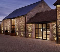 a stone building with lots of windows and lights on it