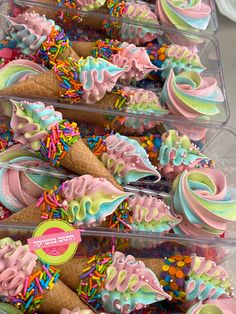 there are many ice cream cones with sprinkles on them