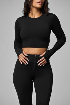 Our Long Sleeve Crop Top is the perfect way to stay comfortable and covered. With tailored sleeve ends and a form-fitting design for full coverage, you can enjoy quick-dry fabric and movement without worry. The details: Cropped length The tailored sleeve ends at the wrist with thumbholes Form-fitting Full coverage design Quick-dry fabric 75% nylon / 25% spandex Long Sleeve Crop Top Outfits, Long Sleeve Cropped Top Outfits, Long Sleeve Black Crop Top, Full Sleeve Crop Top, Full Sleeves Design, Long Sleeve Workout Shirt, Long Sleeve Activewear, Full Sleeve Top, Rolling Loud