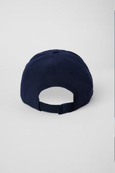 Top off your look with the Performance Off-Duty Cap -- Alo's limited-edition, fresh take on the classic dad cap. This street style must-have features our signature logo and the adjustable back elastic webbing and buckle makes this piece fit for everybody. Classic Baseball Cap With Curved Visor For Sports Events, Classic Baseball Cap For Sports Events, Classic Navy Baseball Cap With Curved Visor, Curved Visor Dad Hat For Sports Events, Navy Hat With Embroidered Logo And Curved Visor, Classic Baseball Cap With Curved Brim For Sports Events, Classic Sports Fitted Hat With Curved Visor, Classic Sports Trucker Hat With Curved Visor, Classic Trucker Hat With Curved Bill For Sports