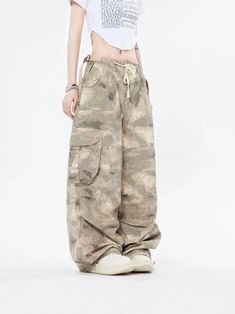 Embrace the street aesthetic with our Faded Baggy Camo Cargo Pants, perfect for making a statement while on the move.
Designed with a natural waist, these cargo pants offer a blend of comfort and durability. The camouflage pattern adds an edgy touch, while the drawstring and convenient pockets provide functionality and ease. The relaxed wide-leg silhouette ensures a nonchalant yet purposeful style, tailored for the contemporary wardrobe.
Pair them with a cropped hoodie and sneakers for running e Spring Cotton Combat Cargo Pants, Spring Combat Cotton Cargo Pants, Baggy Combat Parachute Pants With Wide Legs, Combat Style Baggy Wide Leg Parachute Pants, Y2k Cargo Style Khaki Bottoms, Y2k Khaki Cargo Bottoms, Y2k Style Khaki Cargo Bottoms, Baggy Wide Leg Y2k Cargo Pants, Y2k Style Baggy Full-length Parachute Pants