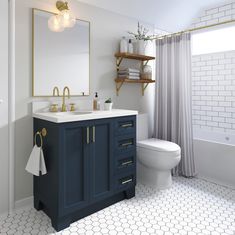 a white toilet sitting next to a blue sink in a bathroom under a large mirror