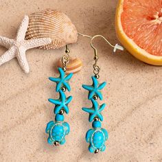 Are you in a beach mood? Our turtle and starfish earrings are fun and unique and make you feel like summer on any occasion. The turquoise pair has nickel-free ear hooks and the coral pair has 18K gold plated ear hooks, both are good for anyone with sensitivities to some metals. The earrings are light weight and comfortable to wear all day. Your earrings will arrive in a silver gift box tied with a colorful fabric ribbon for easy gift giving. To see more jewelry and gifts in our Etsy shop, please Summer Starfish Charm Dangle Earrings, Summer Dangle Earrings With Starfish Charm, Turquoise Jewelry With Starfish Charm For Vacation, Blue Star Jewelry For Vacation, Blue Star Shaped Jewelry For Vacation, Summer Vacation Starfish Jewelry, Summer Starfish Charm Drop Earrings, Handmade Ocean-inspired Earrings For Beach Season, Summer Star-shaped Jewelry For Pierced Ears