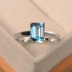 This ring features a 6*8 mm emerald cut London blue topaz,and sterling silver finished with rhodium. Customization is available. It is made by hand, and it will take about 7 days to finish the ring after your payment is completed. Main stone: London blue topaz Main stone weight: Approx 2.01 ct Metal type: sterling silver finished with rhodium Accent stone: none Customization is available, I also can make it with 14k solid gold (white or yellow or rose) and diamond accent stone, just feel free to Blue Gemstone Ring, Rectangle Ring, Birthday Gift Ring, Blue Gemstone Rings, Shaped Sofa, London Blue Topaz Ring, Blue Topaz Ring, Blue Gemstones, Ring Engagement