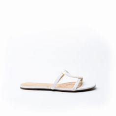 The Melissa sandal is defined by an oversized cutout metal ornament adding glamour to this leather slip on. Made from ultra-soft leather with a molded foam insole, the flat is effortlessly comfortable, and looks just as amazing with pants as it does with dresses. Color: White Leather Upper/Leather Lining/Manmade sole Flat slip on sandal cutout ornament detail 4 mm padded footbed White Leather Flat Heel Slides, White Leather Slides With Textured Sole, White Flat Slides With Buckle Closure, White Non-slip Flat Jelly Sandals, White Slip-on Sandals With Textured Sole, Flat Wedges, Flat Heel Boots, Metal Ornament, Kids Boots