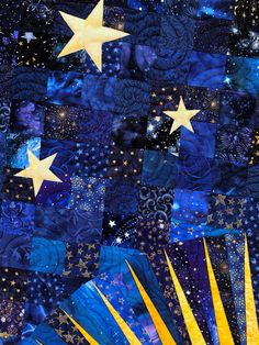 the stars are shining in the night sky with blue and yellow fabric, which has been made into a quilt