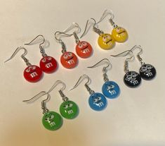 These colorful earrings will bring a smile to all you encounter.  Perfect for your jeans and T-shirt days. Cute earrings for kids and teens, or anyone that wants to add some fun and color. M&m Earrings, Playful Personalized Multicolor Earrings, Playful Multicolor Personalized Earrings, Cute Colorful Earrings For Gift, Casual Personalized Earrings As A Gift, Cute Colorful Earrings As Gift, Cute Colorful Earrings For Gifts, Cute Smiley Face Earrings For Gift, Cute Multicolor Round Earrings