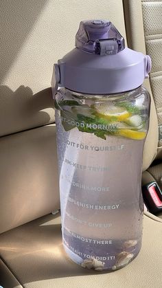 a water bottle sitting in the back seat of a car