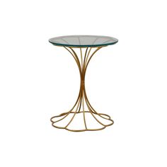 a round glass table with gold metal legs and a circular glass top on an isolated white background