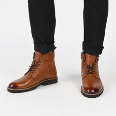 Meet the Simeon boot from Thomas & Vine – a versatile wardrobe essential designed for both style and comfort. Crafted from genuine leather, these lace-up boots effortlessly elevate any outfit, whether you're dressing up with button-ups or keeping it casual with vintage band tees. Featuring a round-toe silhouette, cushioned collar, 6 mm Tru Comfort Foam™ footbed, and a 1 1/4-inch block heel, these boots offer a perfect blend of fashion and support for every occasion. • Round-Toe • Lace-Up • Cushi Winter Leather Lace-up Chukka Boots, Leather High-top Boots With Lace-up Fastening, High-top Leather Boots With Lace-up Fastening, Winter Boots With Front Lace-up Fastening And Round Toe, Winter Leather Footbed Ankle Combat Boots, Winter Leather Ankle-high Combat Boots, Winter Ankle Combat Boots With Leather Footbed, Winter Leather Combat Boots Ankle-high, Winter Leather Ankle Combat Boots