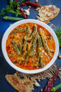 Bhindi Ka Salan is a Hyderabadi style tangy and spicy okra curry. Serve it with biryani or Indian bread for a delicious meal. Here is how to make it (vegan, gluten-free). Spicy Okra, Okra Curry, Food Recipes Vegetarian, Tastemade Recipes