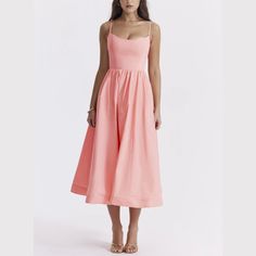 Step into elegance with our Spaghetti Strap A-Line fit and flare Midi Dress. This dress promises a graceful silhouette with its fitted bodice and flowing skirt. The spaghetti straps offer a delicate touch, perfect for both casual outings and special occasions. Made from lightweight, breathable fabric, it's designed for comfort without sacrificing style. Pair it with sandals for a relaxed look or heels to make a statement. Versatile and chic, this midi dress is a wardrobe must-have. Color: White, Fit And Flare Midi Dress, Flare Midi Dress, Bandage Dress Bodycon, Jackets Men Fashion, Flowing Skirt, Pink Midi Dress, White Midi Dress, Fitted Bodice, Short Tops