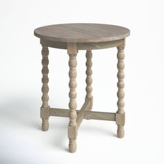 a small wooden table with turned legs