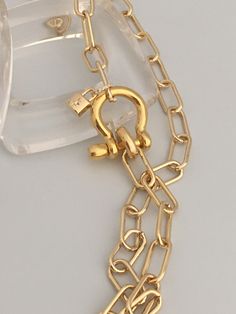 A beautiful shiny gold chain made up of paperclip links. The chain is brass and has several plating coatings of color to give the gold electroplated finish. It is a high quality choker chain. The shackle clasp gives the necklace a modern and unusual edge. It is Gold Plated. Size 21 x 25 mm To finish off this necklace I added a small CZ padlock with a CZ bail. The padlock also features a CZ star. For anyone that has difficulty with necklace closings this one is a breeze! If you look at the pictur Chic Chunky Chain Link Paperclip Bracelet, Chic Gold Toggle Necklace With Paperclip Chain, Gold Toggle Necklace With Paperclip Chain, Gold Chic Toggle Necklace With Paperclip Chain, Gold-tone Link Paperclip Bracelet With Cable Chain, Gold Link Paperclip Bracelet With Lobster Clasp, Gold Chain Link Paperclip Bracelet With Lobster Clasp, Gold-tone Link Paperclip Bracelet With Lobster Clasp, Gold Paperclip Link Bracelet With Lobster Clasp