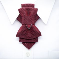 "The hand-made luxury quality original design Bordo bow tie created by Ruty Design is an exquisite and elegant piece of clothing that exemplifies timeless classic style. Crafted with meticulous attention to detail, it embodies sophistication and luxury. The bow tie's deep shade of Bordo, a rich and elegant burgundy hue, adds a touch of opulence to any ensemble. The color itself conveys a sense of refinement and exclusivity, making it a perfect choice for formal occasions or stylish affairs. Ruty Elegant Red Suit And Tie Accessories For Gift, Elegant Red Suit And Tie Accessories For Formal Occasions, Elegant Red Suit And Tie Accessories For Formal Events, Red Formal Suit And Bow Tie Accessories, Elegant Burgundy Suit And Tie Accessories For Business, Elegant Bow Tie With Inside Ties For Party, Elegant Red Bow Tie For Party, Red Dapper Tie For Wedding, Elegant Red Bow Tie For Formal Occasions