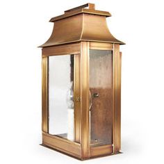 an old fashioned brass lantern on a white background