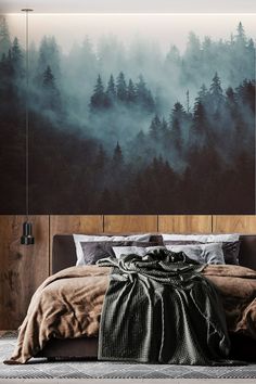 a bedroom with a large painting on the wall above it and a bed in front of it