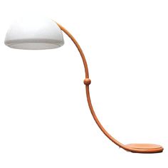 a wooden table lamp with a white shade on it's head and arm, in front of a white background