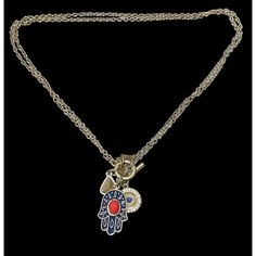 Vintage Hamsa charm necklace from Vintage America by Alan West. Alan West Vintage America Hamsa charm necklace is a beautifully crafted piece of history offering a blend of vintage elegance and spiritual symbolism. Its intricate design and antique finish make it a statement piece. * Vintage inspired hamsa charm * Crafted with attention to detail * Antique finish for authentic look * Perfect statement piece * Symbolizes protection and good luck * 15 inches * 1 3/4 inch charm cluster * Front toggle clasp * Signed Alan West Vintage America Condition: Pre-Owned Like New Antique Good Luck Charms Jewelry, Symbolic Vintage Charm Pendant Jewelry, Symbolic Pendant Jewelry With Vintage Charm, Spiritual Pendant Charm Necklace With Vintage Charm, Good Luck Medallion Necklace With Charms, Symbolic Vintage Medallion Jewelry With Charm, Vintage Metal Necklace With Logo Charm, Symbolic Medallion Charm Necklace, Spiritual Medallion Charm Necklaces