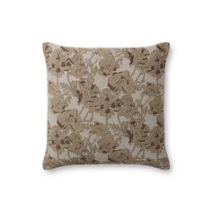 a brown and white pillow with flowers on it