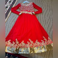 Beautiful Bright Red Color With Golden Color Detail Embroidery Worn Once Has A Light Stain But Other Than That It’s In Great Condition (See Video For Details) Final Sale No Returns Open To Offers Women’s Size Small One Piece Long Anarkali Traditional Drape Red Anarkali Set With Dabka Work, Red Anarkali Set For Festive Season, Red Anarkali Traditional Wear For Festive Occasions, Red Semi-stitched Anarkali Set For Festive Occasions, Red Bollywood Anarkali Set With Traditional Drape, Festive Red Anarkali Set With Dabka Work, Designer Anarkali Churidar In Red, Designer Red Anarkali Churidar, Semi-stitched Red Anarkali Set With Resham Embroidery