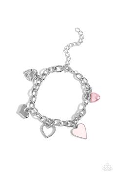 A textured silver heart silhouette, sleek silver heart, sunburst-detailed silver heart, pink-painted heart, and baby pink pearl heart dangle along a silver chain for a romantic declaration. Features an adjustable clasp closure around the wrist. Sold as one individual bracelet. Trendy Pink Metal Bracelet, Trendy Pink Metal Bracelets, Silver Heart Pendant Jewelry With Heart Print, Pink Chain Bracelet With Lobster Clasp, Pink Adjustable Chain Bracelet, Metal Bracelets With Heart Beads, Trendy Pink Sterling Silver Jewelry, Pink Heart Pendant Metal Jewelry, Pink Heart Pendant Jewelry