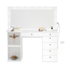 a white desk with drawers and an electronic device sitting on it's top shelf