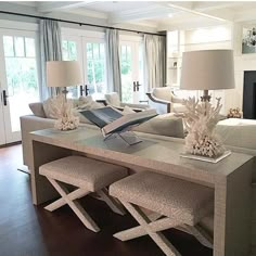 a living room filled with furniture and a fire place