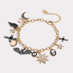 Unveil a touch of eerie enchantment with our Halloween Charm Bracelet. This macabre masterpiece, clad in 18K gold on brass, conjures visions of a spine-chilling soirée. Adorned with a dripping oil charm, it's as if the very essence of a haunted house has been captured. Sparkling cubic zirconia stones add a ghostly glow, casting a bewitching spell under the moonlight. A perfect accessory for those who revel in the gothic and grotesque. Dare to be different and let your Halloween spirit shine. DET Charm Bracelet Tattoo, Halloween Charm Bracelet, Xoxo Jewelry, A Haunted House, Tattoo Bracelet, Halloween Charms, Brass Bracelet, Halloween Spirit, Halloween Jewelry