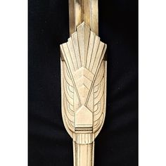 an art deco wall hanging made out of wood