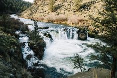 there is a small waterfall in the mountains