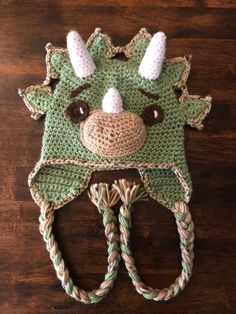 a crocheted animal hat with horns and ears