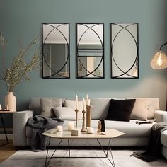 a living room with three mirrors on the wall and furniture in front of it,