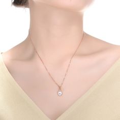 Add a stunning luster to your look with this pearl solitaire pendant necklace that features a white round shell pearl solitaire pendant with a subtle accent of clear round cubic zirconia to complement the pearl. This necklace is crafted in .925 Sterling silver with gold plating and secures with a spring ring clasp. The basic yet gorgeous design of this necklace will look great with any ensemble. Only if necessary, use a suede cloth and delicately clean the surface of the jewel Item Should not co Rose Gold Pearl Chain Necklace, Rose Gold Round Jewelry With Pearl Charm, Round Rose Gold Jewelry With Pearl Charm, Elegant Rose Gold Teardrop Pendant Necklace, Fine Jewelry Rose Gold Necklace With Pearl Pendant, Rose Gold Pearl Pendant Necklace In Fine Jewelry, Rose Gold Round Necklace With Pearl Pendant, Rose Gold Pearl Pendant Necklace Fine Jewelry, Elegant Teardrop Pendant Necklace With Single Diamond