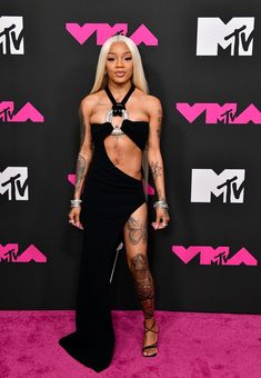 nicki mina at the vmas awards in a revealing cutout dress with thigh high slits