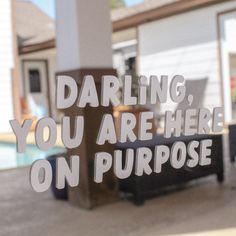 there is a sign in the window that says daring, you are here on purpose