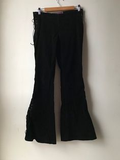 "Size: 5/6 Tall Closure: Sides Lace-up, nothing else. No zipper or belt loops. Condition: Pre-owned vintage excellent. No visible rips stains or imperfections. Measurements (lying flat not stretched): Waist 14.5\" (slightly adjustable with laces). Inseam 30.5\"" Edgy Cotton Bottoms For Festival, Y2k Cotton Bottoms For Concert, Black Grunge Pants For Festival, Fitted Grunge Pants For Fall, Fitted Grunge Bottoms For Concerts, Fitted Punk Style Pants For Concerts, Grunge Pants For Fall, Stretch Grunge Pants For Alternative Fashion, Fitted Alternative Bottoms For Concerts