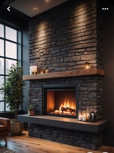 a fireplace with candles lit in front of it