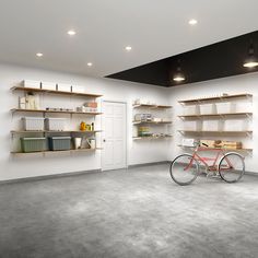 a bike is parked in the middle of a room with shelving on both sides