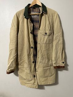 Vintage Cream Jacket  - Cream brand - Plaid lined  - Interior pocket  - Outer pockets  - Corduroy collar  - Leather cuff  - Natural wear age and distressing  Size: Large (oversized fit) Good vintage condition  No rips or holes  No stains Rugged Button-up Outerwear With Pockets, Classic Utility Jacket With Corduroy Collar, Classic Utility Jacket With Corduroy Collar And Long Sleeves, Rugged Button-up Outerwear With Patch Pockets, Rugged Cotton Button-up Outerwear, Rugged Cotton Outerwear For Work, Rugged Utility Jacket With Long Sleeves For Workwear, Vintage Winter Utility Jacket With Lapel Collar, Vintage Khaki Outerwear With Patch Pockets