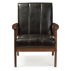 a black leather chair sitting on top of a white floor next to a wooden frame