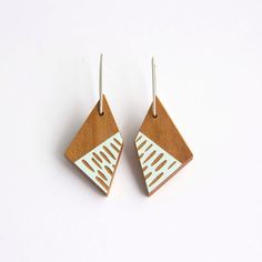 Feel fashionably on trend wearing our playful Dots and Dashes Wooden Earrings. Made from Ancient Kauri, with stirling silver ear hooks, these earrings are light and easy to wear.Size: H 55mm x W 20mmFinish: beeswax and tung oil polish Bird Mobile, Tung Oil, Earring Trends, Social Media Design Inspiration, Stirling, Wooden Earrings, Ear Hook, Earrings Photo, Etsy Fashion