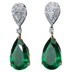 Introducing our exquisite Green Emerald and Diamond Earrings, a testament to exceptional craftsmanship and unparalleled beauty. These remarkable earrings feature a pair of pear-shaped diamonds, each weighing 0.49 carats, adorned with a scintillating diamond halo. A round diamond, weighing 0.45 carats, elegantly separates the pear diamonds from the pièce de résistance—the magnificent green emeralds. Certified by GRS (GemResearch Swisslab), the emeralds in these earrings are of the highest quality 1stdibs Earrings, Emerald And Diamond Earrings, Yellow Gold Setting, Emerald Earrings, Pear Diamond, Pear Shaped Diamond, Green Emerald, Diamond Halo, Natural Emerald