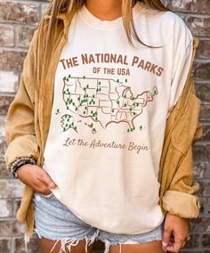 Map of USA National Parks. Which ones can you cross off of your bucket list? The Comfort Colors C1717 100% Ring Spun Cotton T-Shirt is very appropriately-named. All colors are inspired by nature and have a perfect lived-in, weathered look. Shirts are sent through a unique dyeing process that makes them incredibly soft and long-lasting. Each piece is soft-washed 50 times before making its way to you! Stitched at the collar, armhole, sleeves and bottom hem for ultimate durability, you will notice Graphic Cotton Tee For Urban Adventures, Graphic Tee Cotton Top For Urban Adventures, Crew Neck Cotton Top For Urban Adventures, Cotton Crew Neck Top For Urban Adventures, Crew Neck Top For Camping, Cotton Graphic Print Tops For Outdoor Activities, Cotton Crew Neck Top For Camping, Cotton Graphic Tee For Camping, Cotton Screen Print Tops For Outdoor Activities