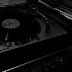 a turntable sitting on top of a record player